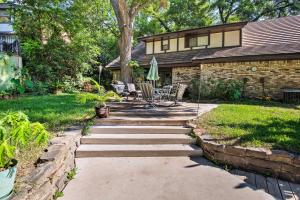 a backyard with a stone walkway leading to a house at Dallas Area Home with Pool - 18 Mi to ATandT Stadium! in Duncanville