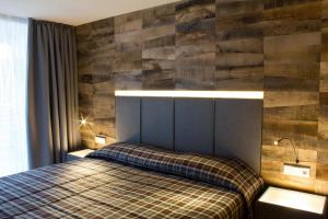 Voodi või voodid majutusasutuse Hotel Col Alto toas