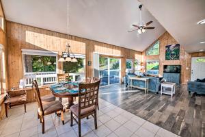 a kitchen and living room with a table and chairs at Hood Canal Home with Hot Tub - Bordering Olympic NP! in Brinnon