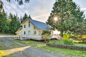 a white house with a gambrel roof at Hood Canal Home with Hot Tub - Bordering Olympic NP! in Brinnon