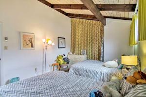 a bedroom with a bed and a window at Walk to Dewey Beach Bright Condo with Balcony! in Dewey Beach
