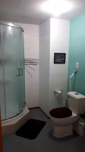 a bathroom with a glass shower and a toilet at Wettstone Guest Ranch in Bridge Lake