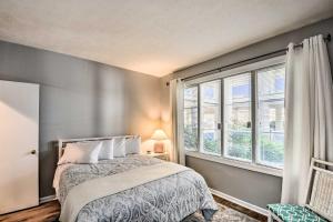 a bedroom with a bed and a large window at Lake Keowee Condo with Views and Pools and Marina! in Salem