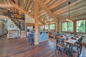 a dining room and kitchen in a log home at Custom Livingston Apt with Balcony and Mountain Views! in Livingston