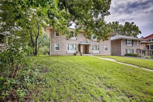 a large brick house with a grass yard at Kansas City Apt, Walk to KC MuseumandMed School in Kansas City