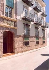 un edificio con balcones en un lateral en Apartamentos Balcon de Carabeo en Nerja