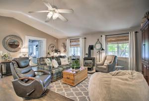 a living room filled with furniture and a ceiling fan at The Lake House in Rathdrum with Beach and Fire Pit in Rathdrum