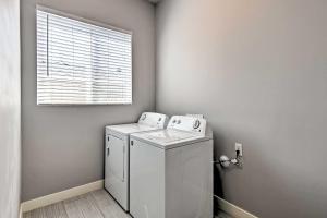 a washing machine in a room with a window at 7 Mi to Dtwn Phoenix Home with Patio and Yard in Phoenix