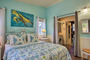 a bedroom with a bed and a painting on the wall at The Lake House in Rathdrum with Beach and Fire Pit in Rathdrum