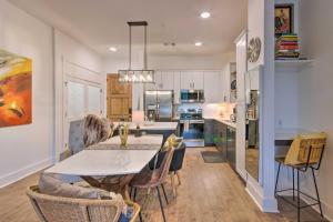 a kitchen and dining room with a table and chairs at Walkable Downtown Asheville Condo with Balcony in Asheville