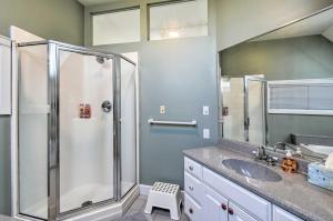 a bathroom with a shower and a sink at Deck and Fire Pit Waterfront Lake Michigan Escape in Algoma +23 photos