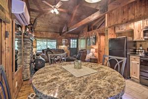 a kitchen with a large marble table in a room at Secluded Stanardsville Cabin with 10 Acres and Hot Tub in Stanardsville