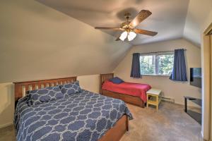 a bedroom with a bed and a ceiling fan at Cabin in Natl Forest 35 Min to Boreal Resort in Colfax