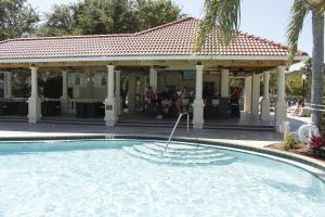 a swimming pool in front of a house with a pavilion at Star Island Resort and Club - Near Disney in Kissimmee