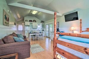 a bedroom with a bed and a living room at Ranch Cabin with Decks, 10 Mi to Fredericksburg in Fredericksburg