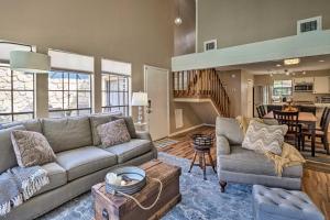 a living room with a couch and a table at Horseshoe Bay Resort Townhome - Near Lake LBJ! in Horseshoe Bay