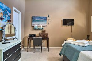 a bedroom with a desk and a bed and a sink at Horseshoe Bay Resort Townhome - Near Lake LBJ! in Horseshoe Bay