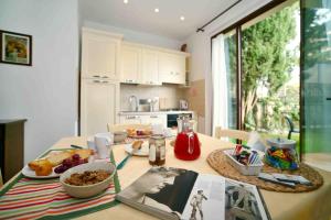 a kitchen with a table with food on it at La Compagnia del Chianti in San Donato in Poggio