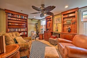 a living room filled with furniture and a ceiling fan at Unique and Historic Home Walk to Lake Champlain in Plattsburgh