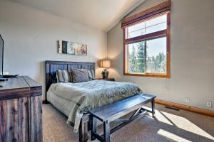 a bedroom with a bed and a window at Truckee Escape with Hot Tub Near Ski Resorts in Truckee