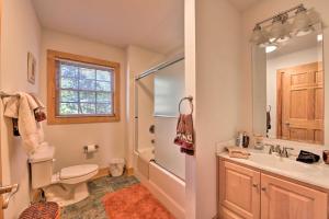 a bathroom with a shower and a toilet and a sink at A Bit of Heaven Cabin Less Than 13 Miles from Boone! in Fleetwood +25 photos