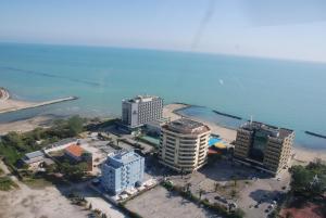 an aerial view of some buildings on the beach at Hotel Piper & River in Montesilvano