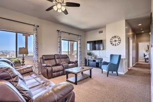a living room with a couch and a table at Pet-Friendly Adobe about 3 Miles to Lake Powell! in Wahweap