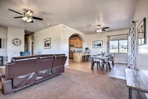 a living room with a table and a dining room at Pet-Friendly Adobe about 3 Miles to Lake Powell! in Wahweap