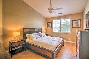 a bedroom with a bed and a ceiling fan at California Gem Pool, 6 Mi to Dtwn Palm Springs! in Cathedral City +23 photos