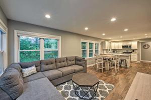 a living room with a couch and a kitchen at Updated Twin Lakes Cottage, Walk to Lake Mary in Twin Lakes