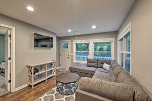 a living room with a couch and a table at Updated Twin Lakes Cottage, Walk to Lake Mary in Twin Lakes