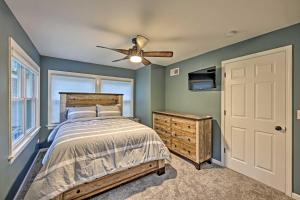 a bedroom with a bed and a ceiling fan at Updated Twin Lakes Cottage, Walk to Lake Mary in Twin Lakes