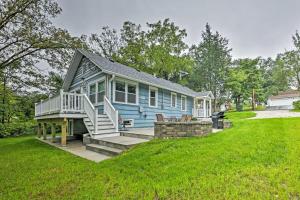 a blue house with stairs and a lawn at Updated Twin Lakes Cottage, Walk to Lake Mary in Twin Lakes