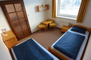 Postel nebo postele na pokoji v ubytování Pension Sport