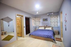 Katil atau katil-katil dalam bilik di Amazing Grace Hostel and International Serviced Apartments