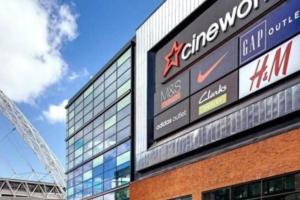 a building with a sign on the side of it at Stylish Wembley Stadium and SSE Arena Apartment, London in London