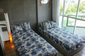 Ένα ή περισσότερα κρεβάτια σε δωμάτιο στο Ancorar Porto de Galinhas Flats