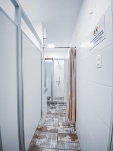 a corridor in a room with a glass door at Charruas hostel in Montevideo