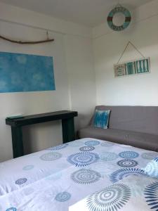 Letto o letti in una camera di La Colline Business & Tourisme