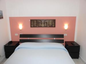 Cama ou camas em um quarto em Hotel Fiammetta