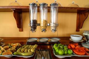 a table topped with lots of different types of fruits and vegetables at Vida Loca Sunset Beach Resort in Phu Quoc