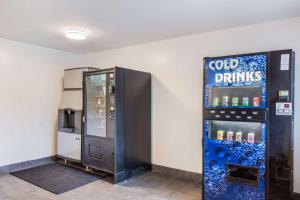 a vending machine with cold drinks in a room at Studio 6 Extended Stay - Jacksonville, FL - South in Sunbeam