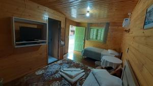 Uma TV ou centro de entretenimento em Pousada Oliveira - Cambara do Sul-RS