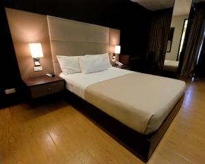 Postel nebo postele na pokoji v ubytování 3G Garden Hotel