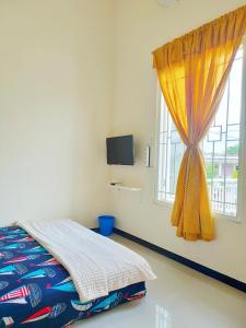 Кровать или кровати в номере Surabaya Homey near ITS