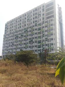 a large white building with trees in front of it at ENVIRO Studio in Cikarang