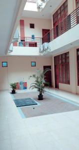 a large courtyard with plants in a building at Residence Duksina 2 By SHM in Yogyakarta