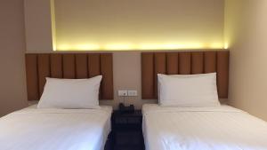 Postel nebo postele na pokoji v ubytování The Phoenix Hotel Bangkok - Suvarnabhumi Airport