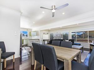 a dining room with a table and chairs at Driftwood House in Port Fairy