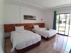 Кровать или кровати в номере Chinita Boutique Hotel